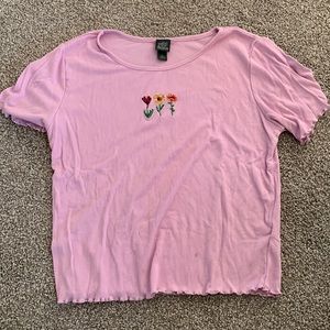 Medium Pink Shirt with Flowers on front.